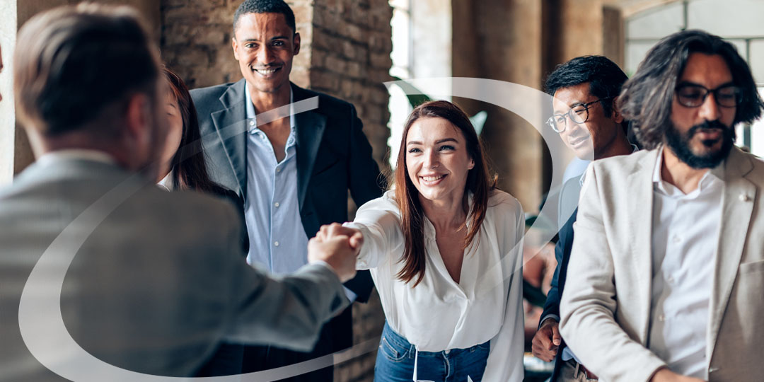 business people shake hands in an office