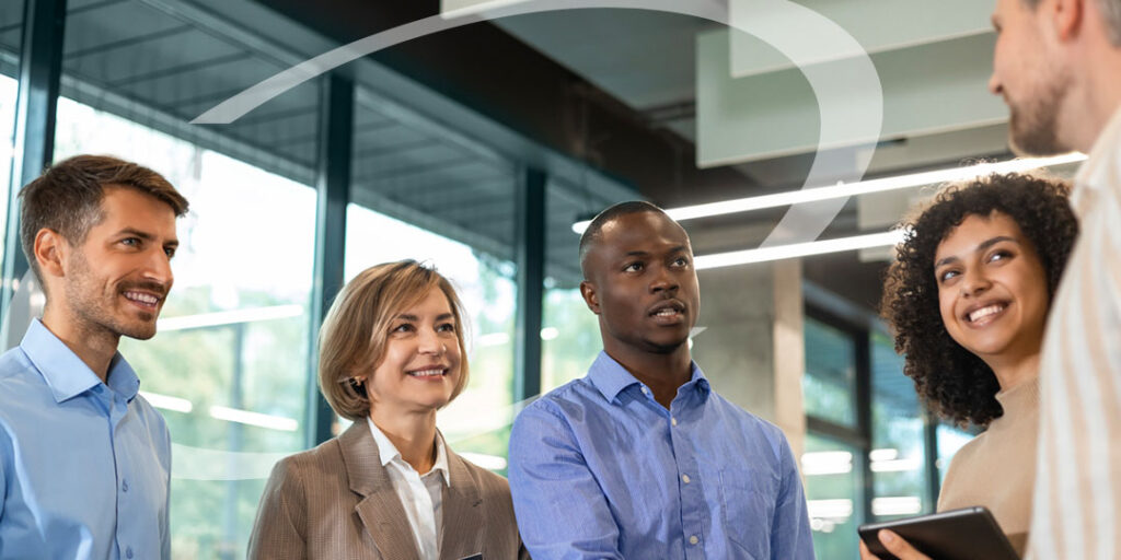 5 businessmen and women shaking hands