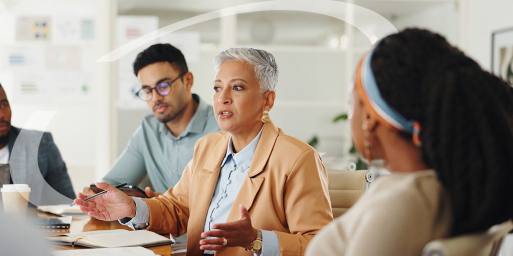 businesswomen discusses with a handful of business owners