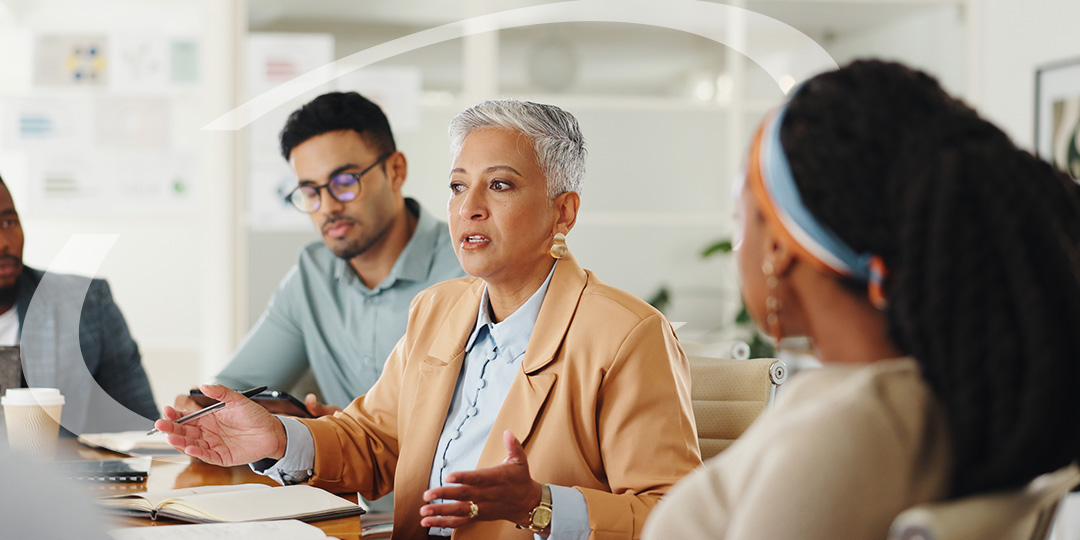 businesswomen discusses with a handful of business owners