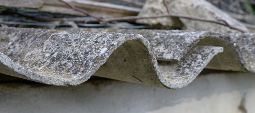 Eaves of a house roof infested with mold