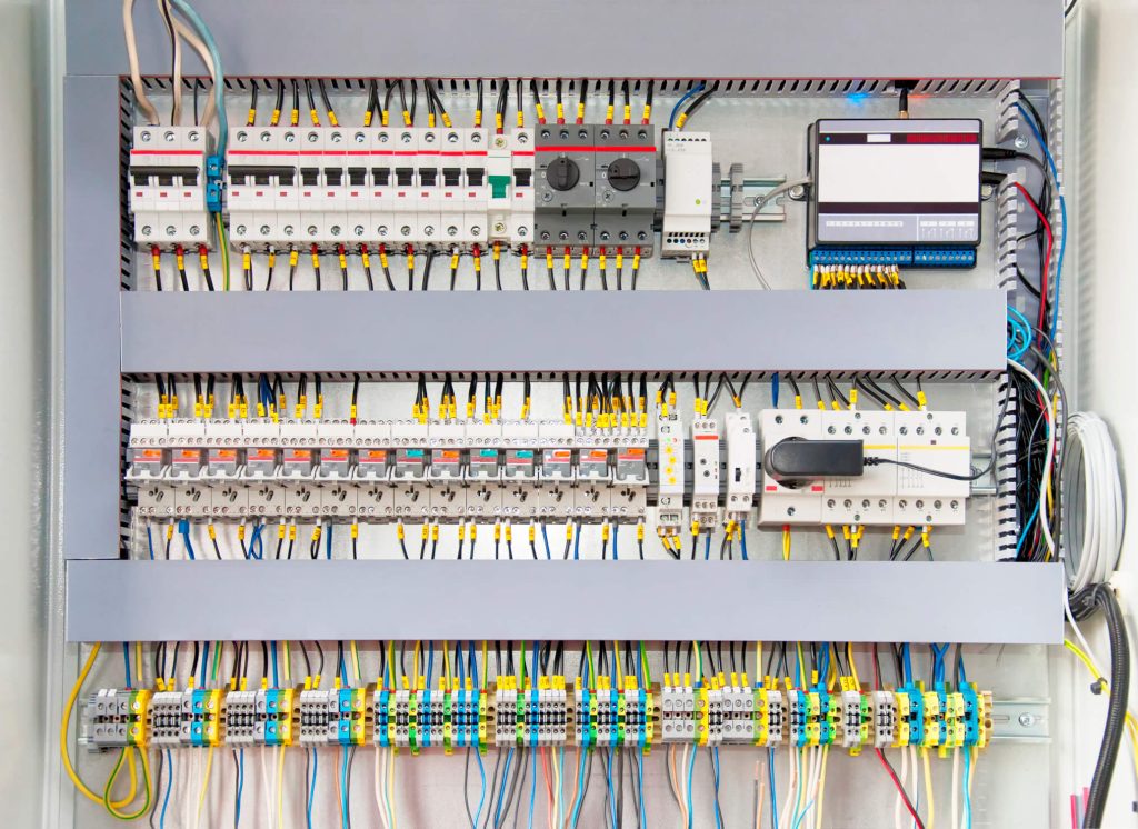 A collection of electrical wires connected to switch boxes.