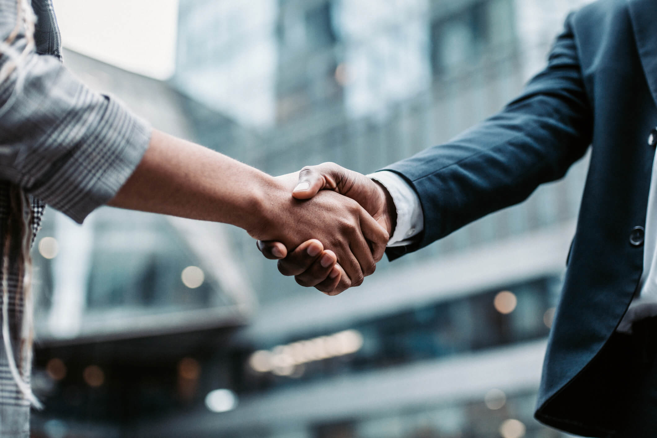 A businessman shaking hands with a client