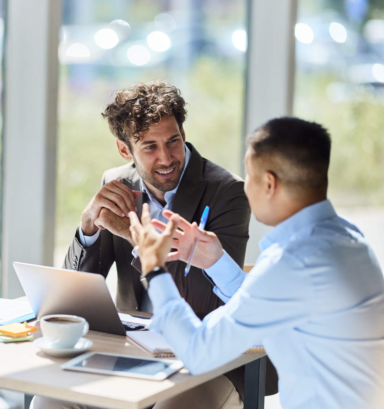 Two businessman discussing a deal