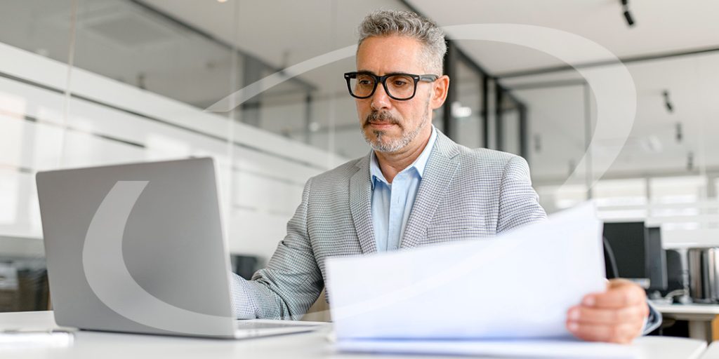 man sitting at a laptop